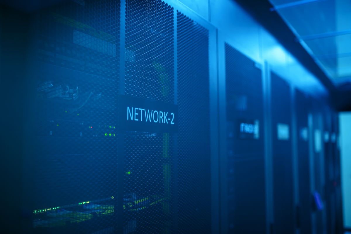 Locked network equipment racks in a secured server room