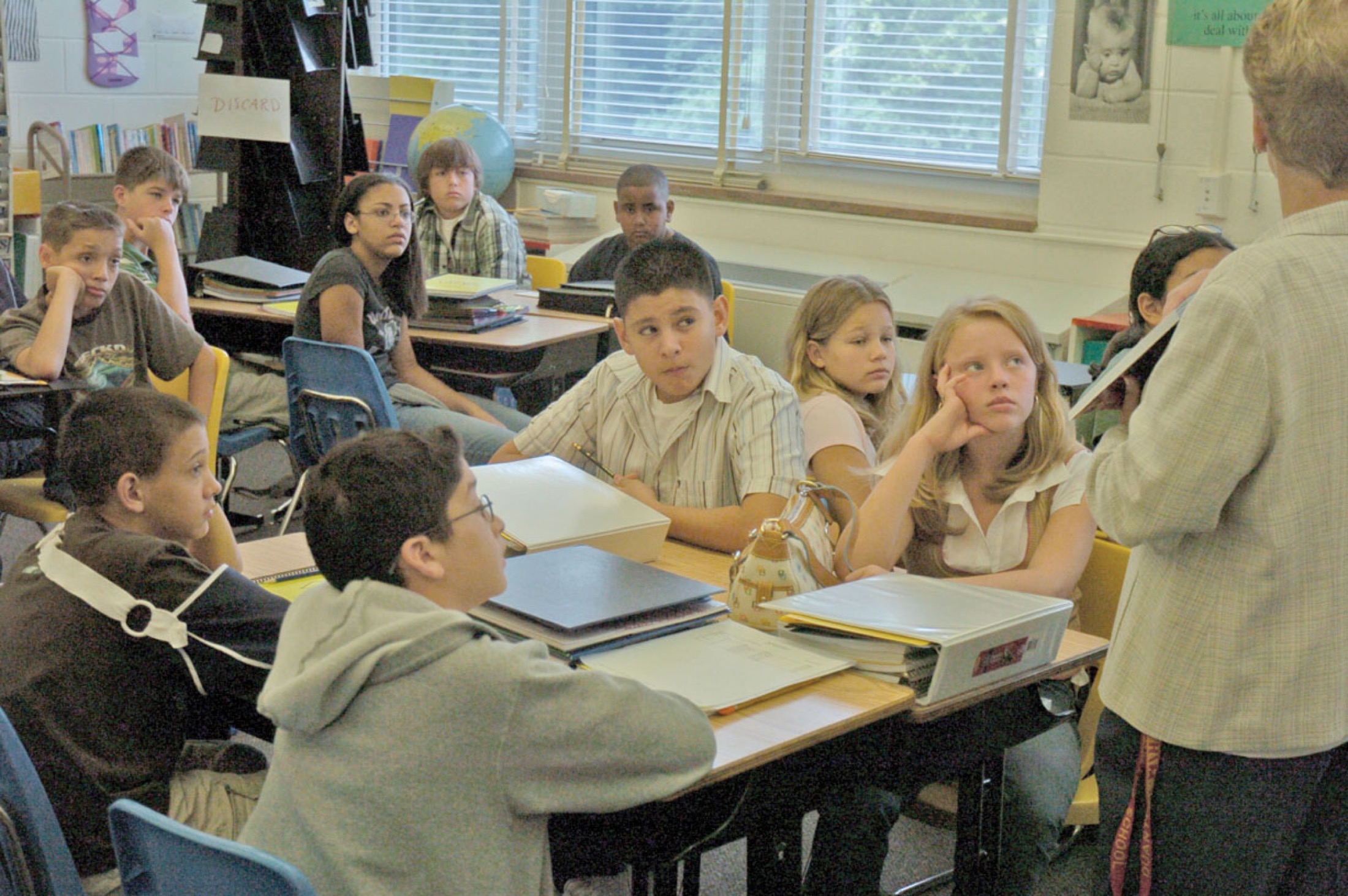 U.S. middle school students listening during classroom instruction
